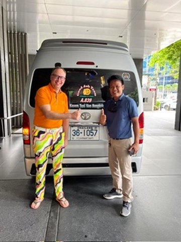 Tourists posing with our van